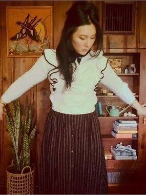 Six outfits (tops/sweaters/vests only).